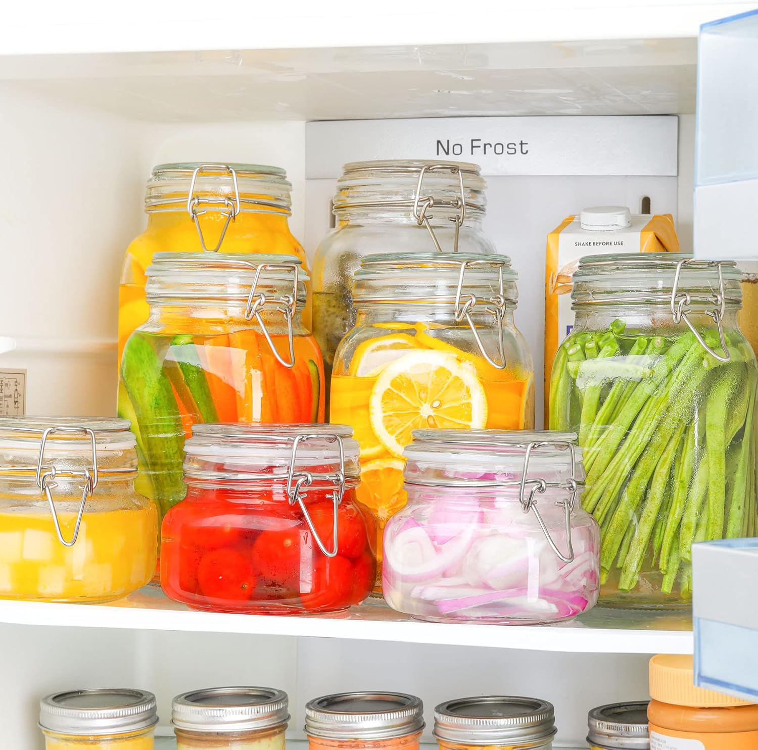Airtight glass storage jars neatly organized in a kitchen pantry shelf