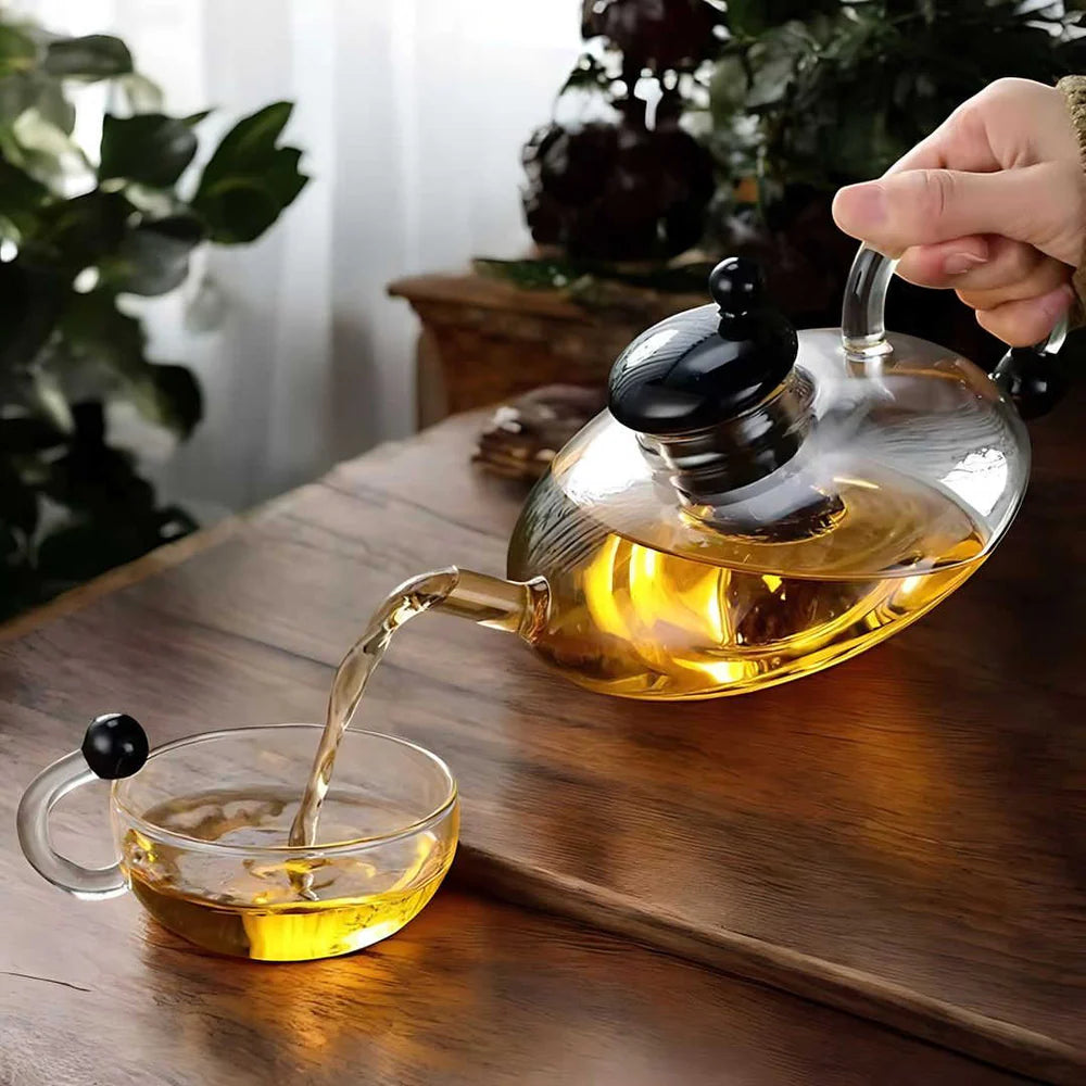 Minimalist tea setup featuring Sereno teapot and two glass cups on marble surface